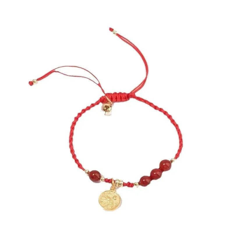 Cinnabar braided rope bracelet with blessing card, shown in black, red, or wine red with round bead or flower charm.