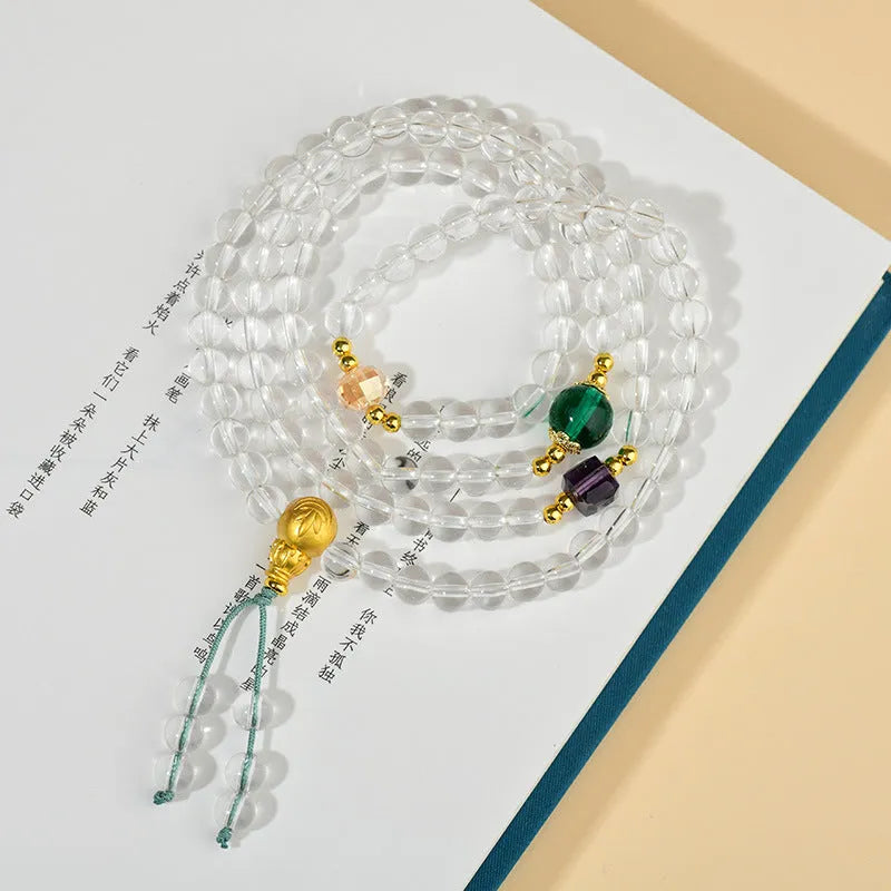 White crystal 108 bead geometric ethnic style bracelet necklace shown worn as both bracelet and necklace