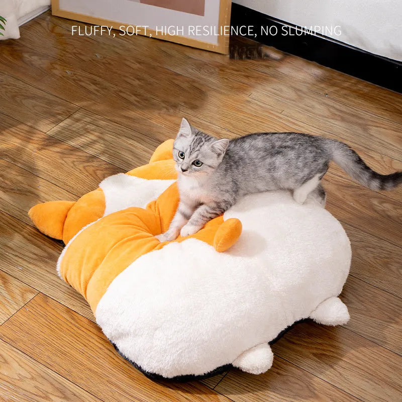 Orange semi-closed cat sleeping bag nest bed on a floor