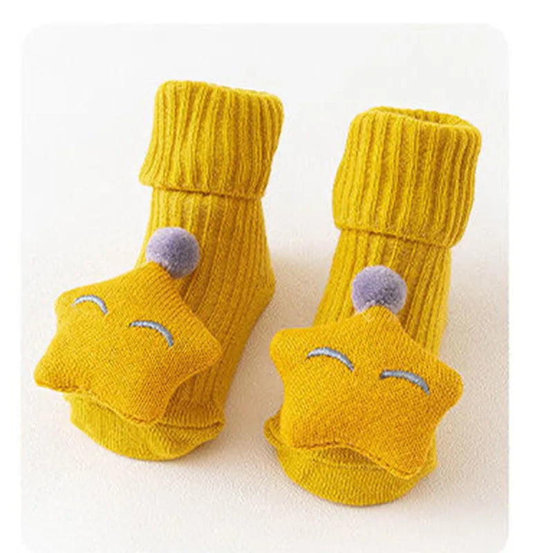 Cotton baby floor socks in a pink bow pattern, shown on an infant's feet.