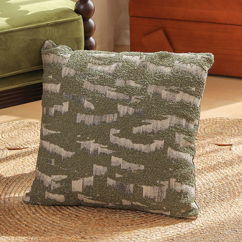 Close-up of a 45cm square jacquard cushion cover with a woven floral pattern in retro Nordic style.