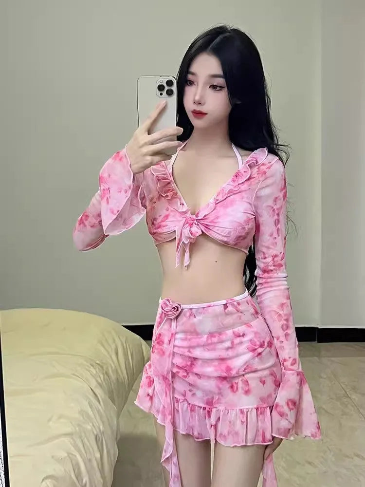 Women's cherry blossom pink floral print bikini swimsuit set on a white background