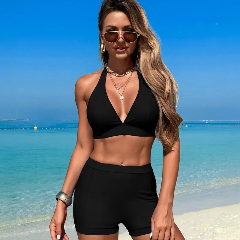 Women's black nylon bikini swimsuit on a hanger, Asian sizing.