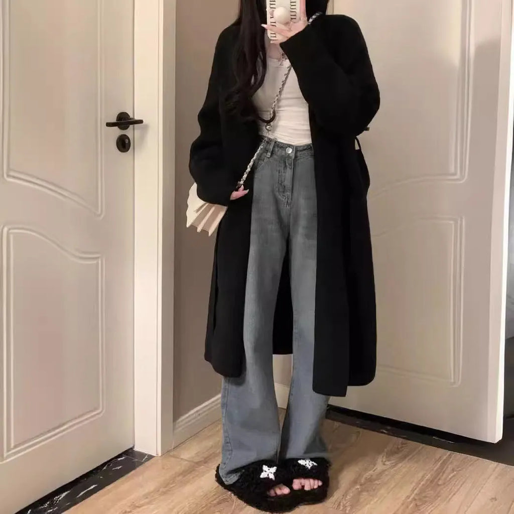 Women's loose fit grey knitted V-neck cardigan coat with long sleeves, shown mid-length.
