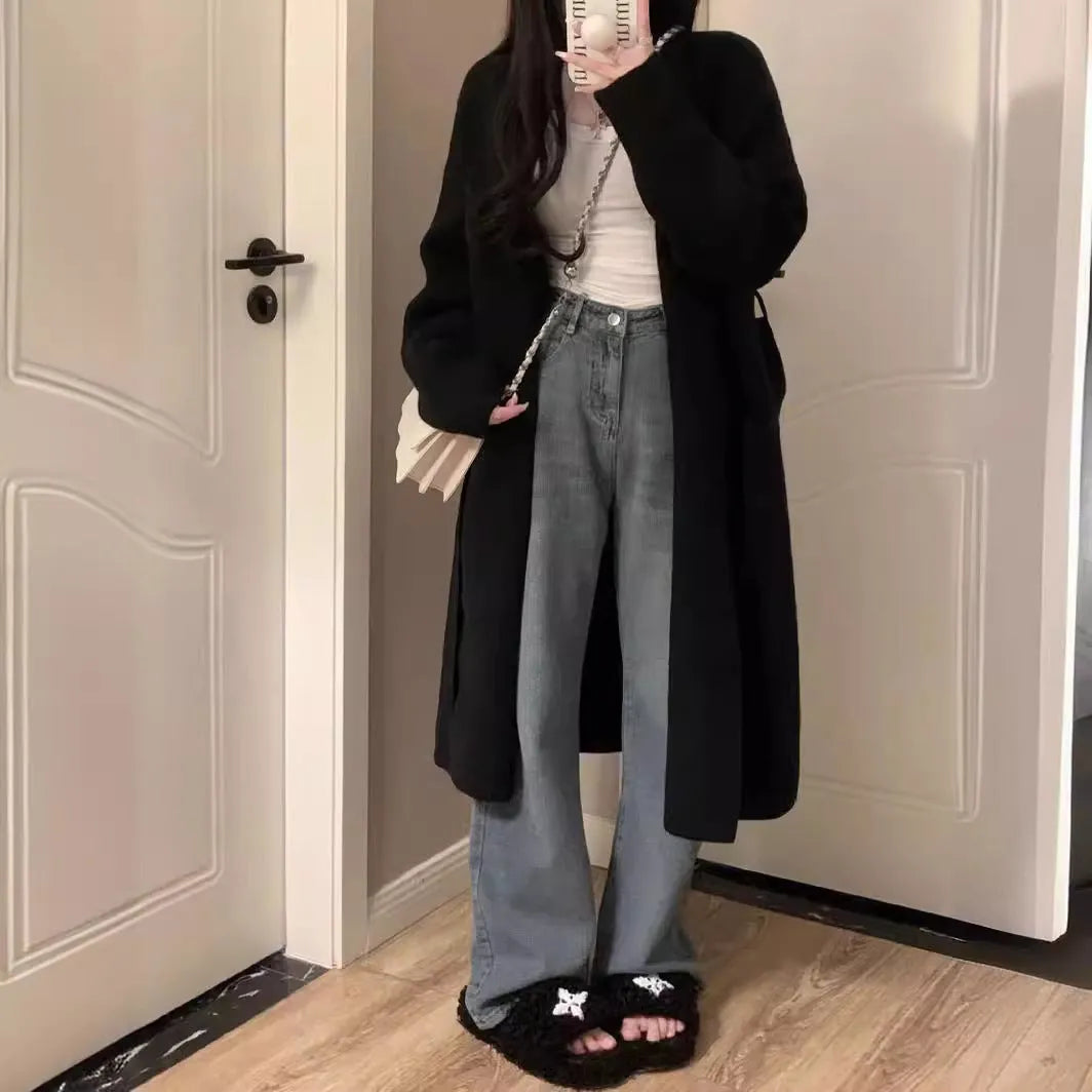 Women's loose fit grey knitted V-neck cardigan coat with long sleeves, shown mid-length.
