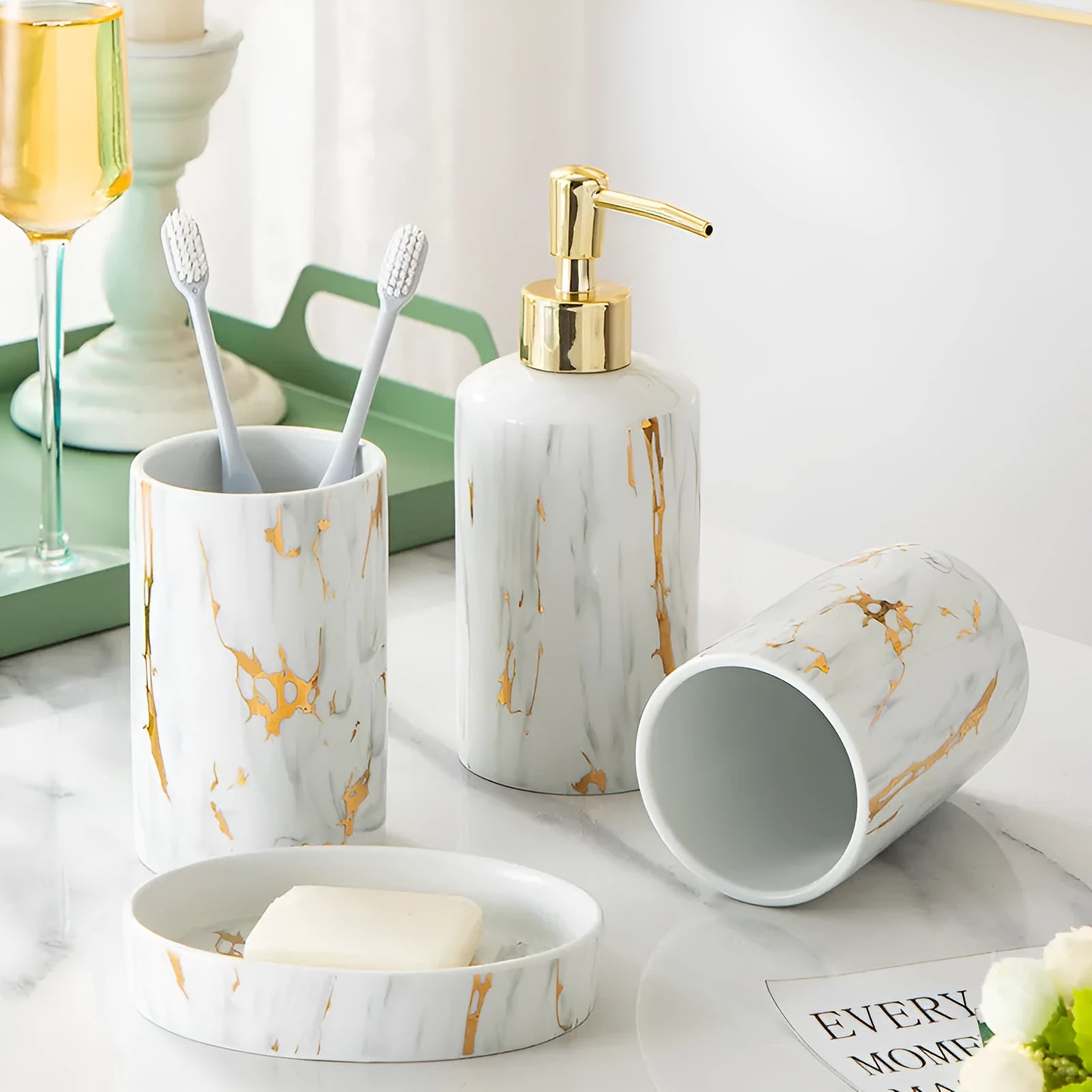 White ceramic bathroom wash kit set with two cups, a soap dish, and a bottle in a presentation box.