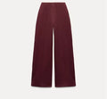 Women's black polar fleece suit set with long sleeve pleated top and wide leg trousers