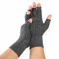 Grey half-finger compression gloves with anti-slip grip palm, shown in a flat lay.