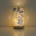 Creative USB table lamp with fabric shade in blue butterfly pattern on modern desk