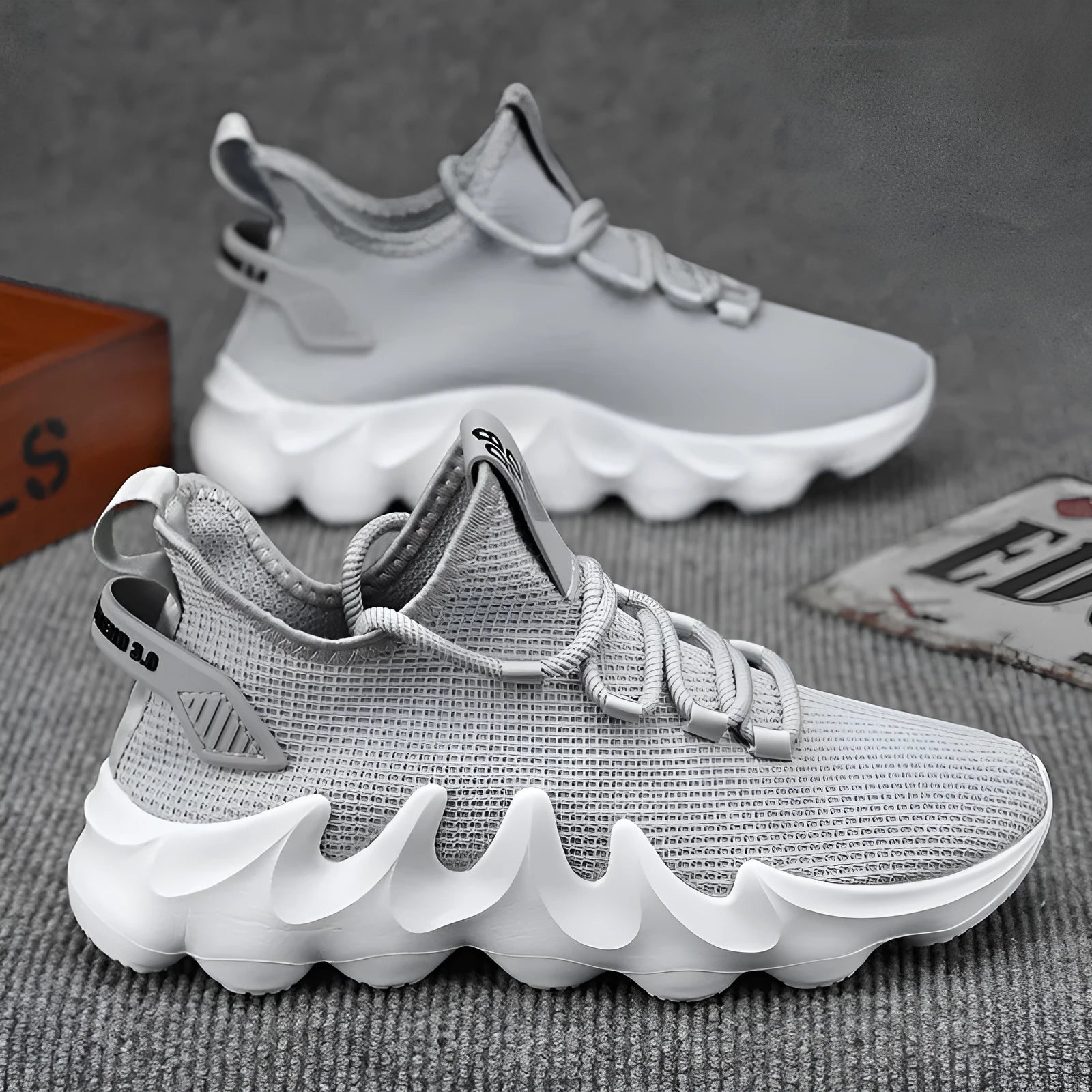 Men's black lightweight sock-like sports shoes with lace-up front and round toe on wear-resistant sole.