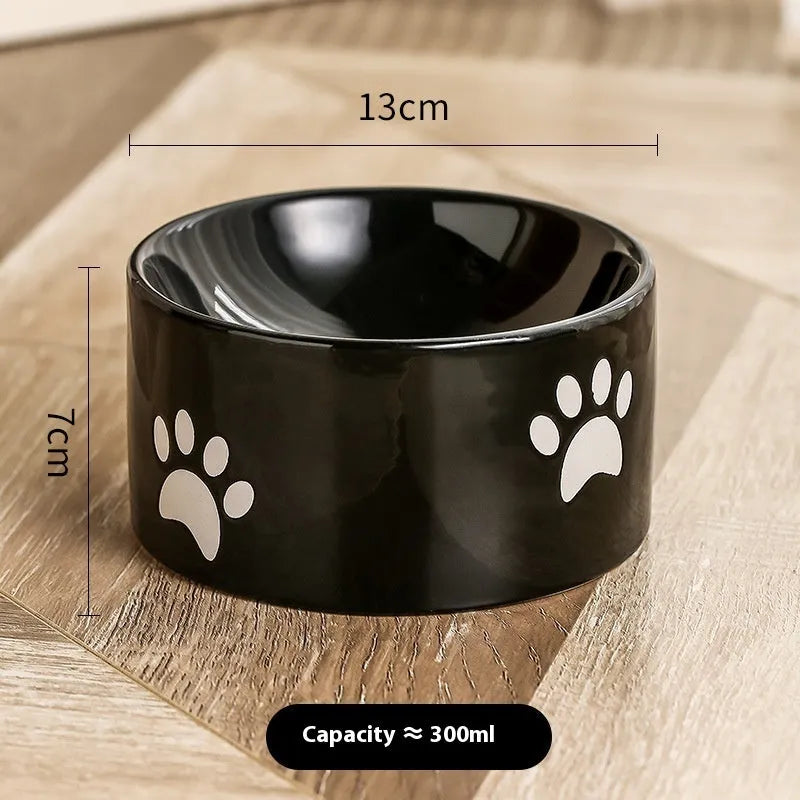 Ceramic cat bowl with high foot design and oblique mouth in cat's paw pattern