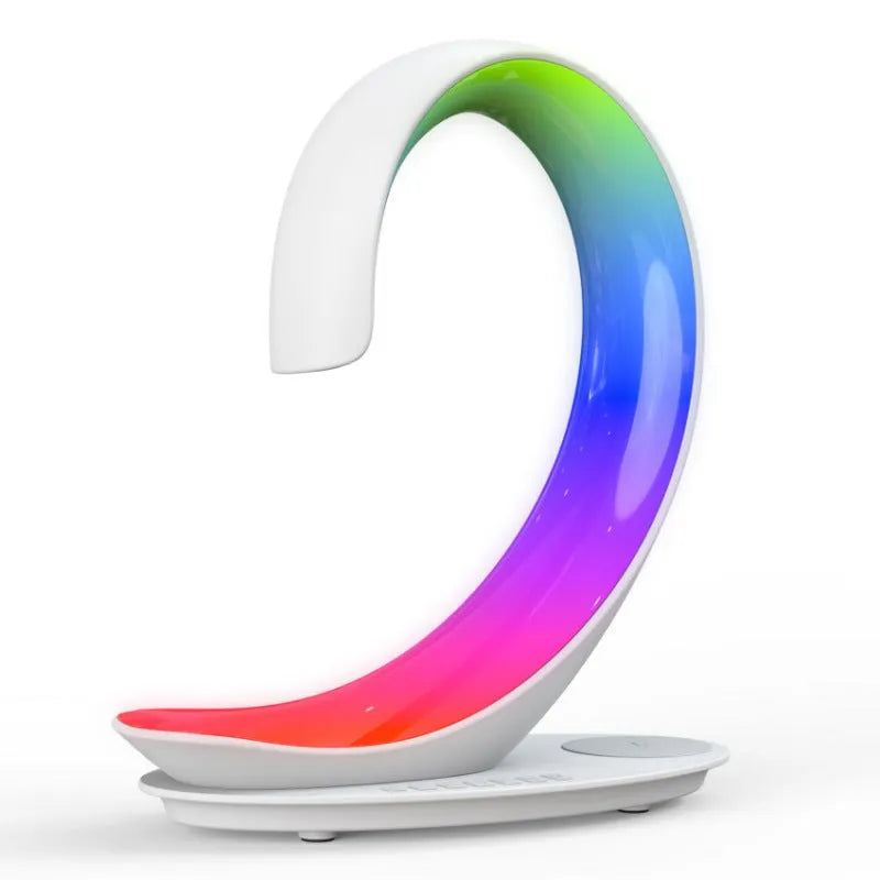 White swan shaped desk lamp with wireless charging pad, Bluetooth speaker and colourful LED lighting