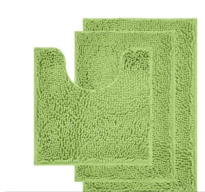 Dark green chenille U-shaped three-piece bathroom toilet carpet set on tiled floor.