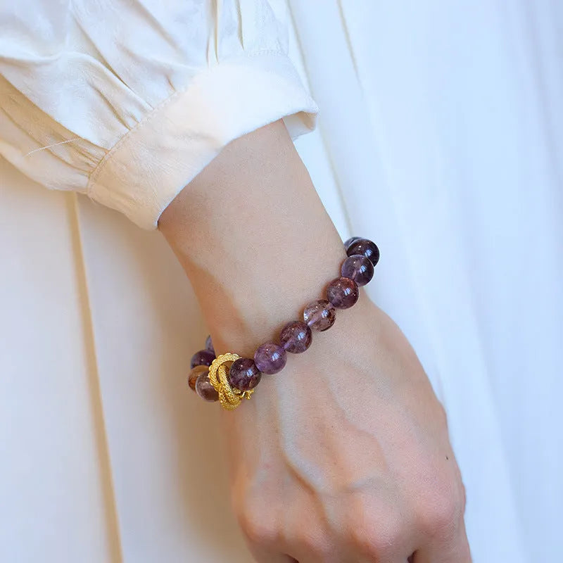 Purple crystal bracelet with nine charms, animal zodiac motifs, and 10mm beads