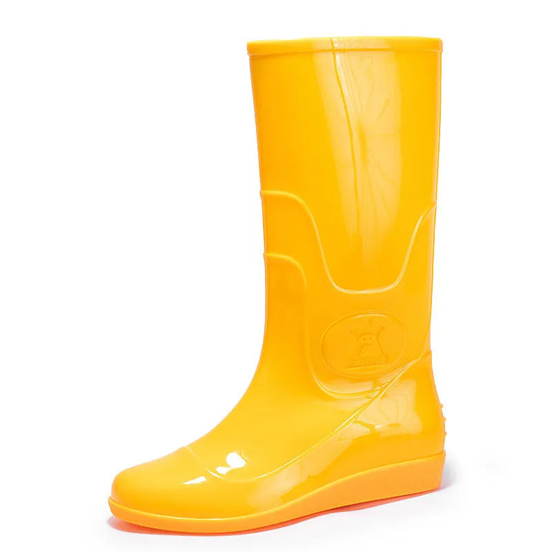 Plastic high tube rain boots in white colour with flat heel and round toe design