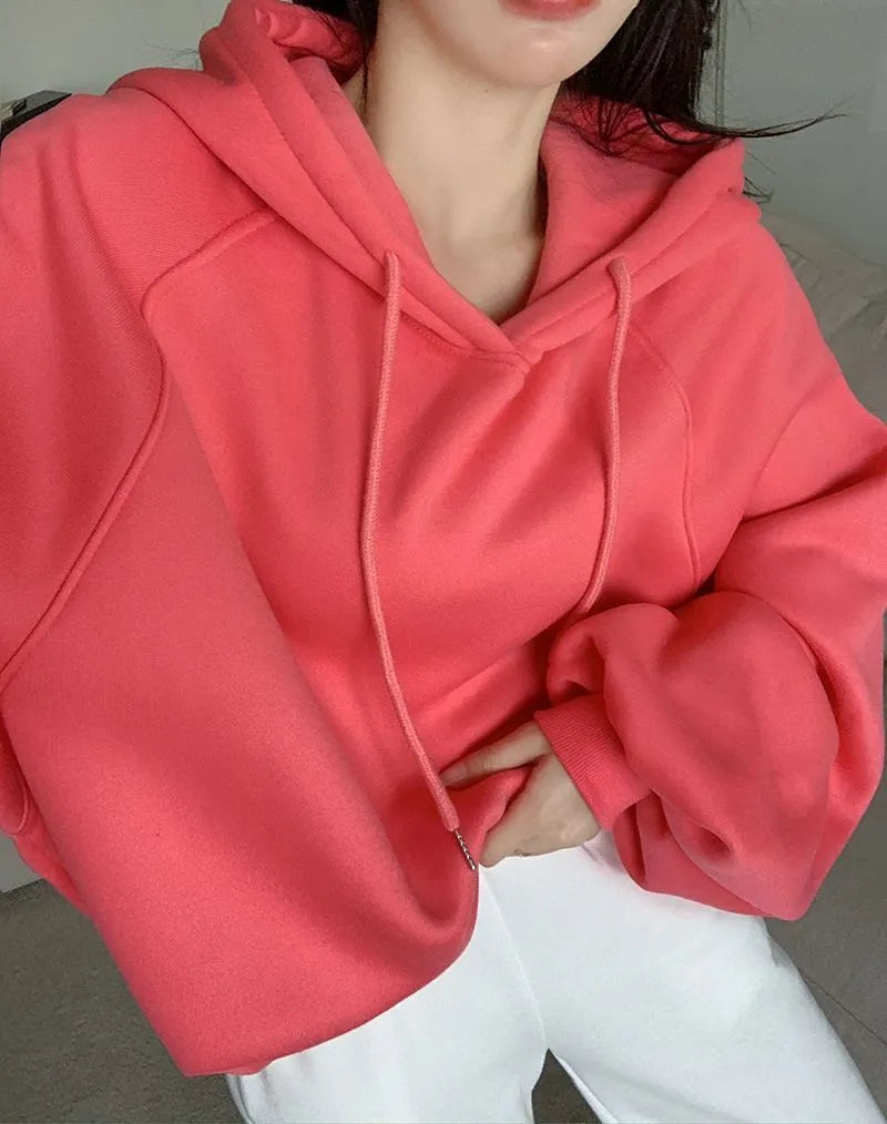 Watermelon red women's sleeveless hooded sweater made from mulberry silk, shown loose fit.