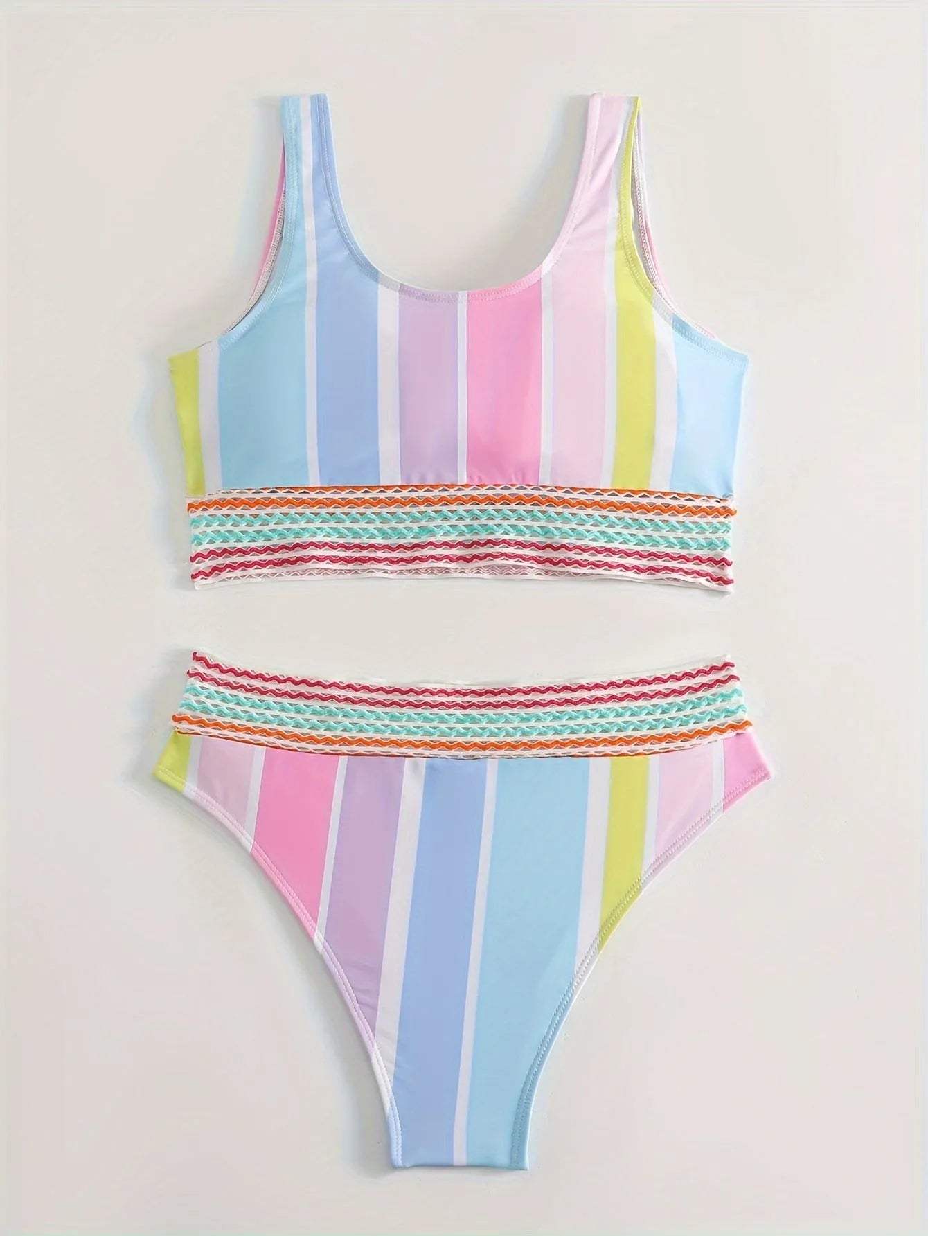 Striped women's bikini top and bottom set for sports swimming.