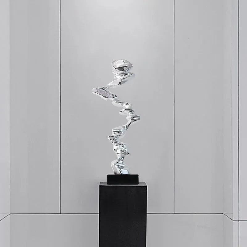Abstract minimalist resin ornament in metallic colours for modern interior decoration