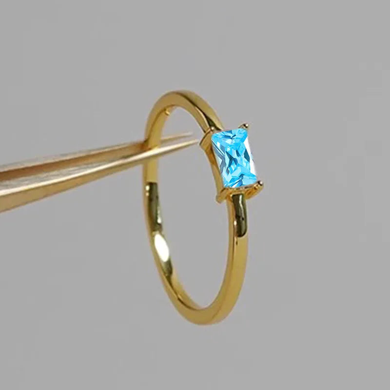 Sapphire blue geometric bracelet ring with zircon stones and heart-shaped elements on copper