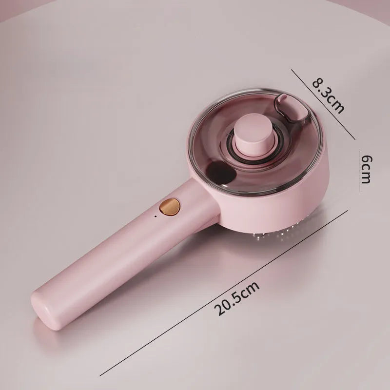 Pink and white cat steam brush with adjustable spray and rounded massage head for pet grooming