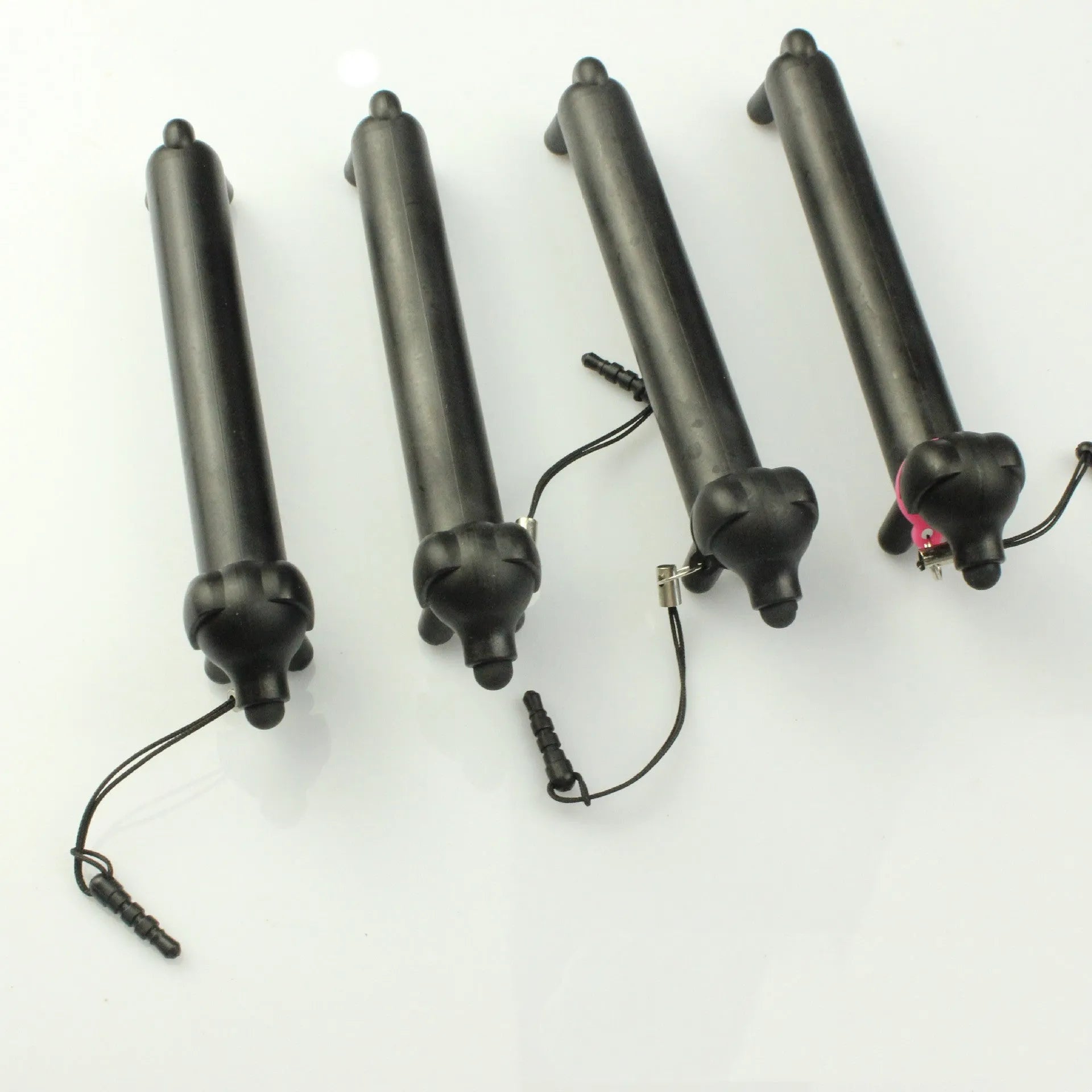 Black dog-shaped touch screen stylus with adjustable length and phone holder stand base