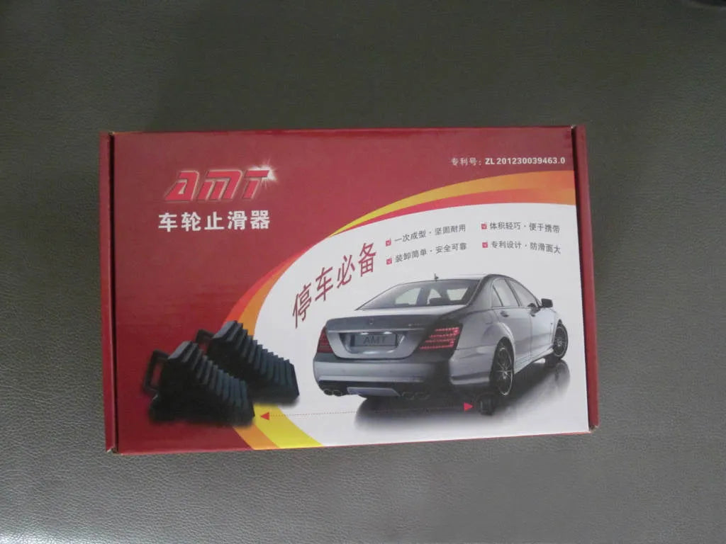 A pair of black triangular car wheel chocks for anti-slip parking safety.