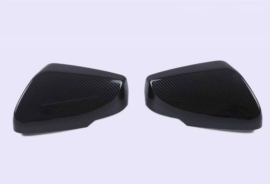 Pair of ABS plastic rearview mirror covers for Cadillac CT5 and CT6 cars in carbon fibre pattern finish.