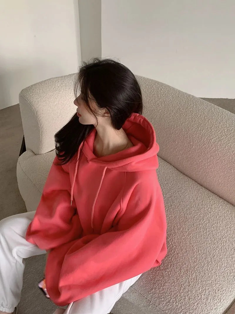 Watermelon red women's sleeveless hooded sweater made from mulberry silk, shown loose fit.