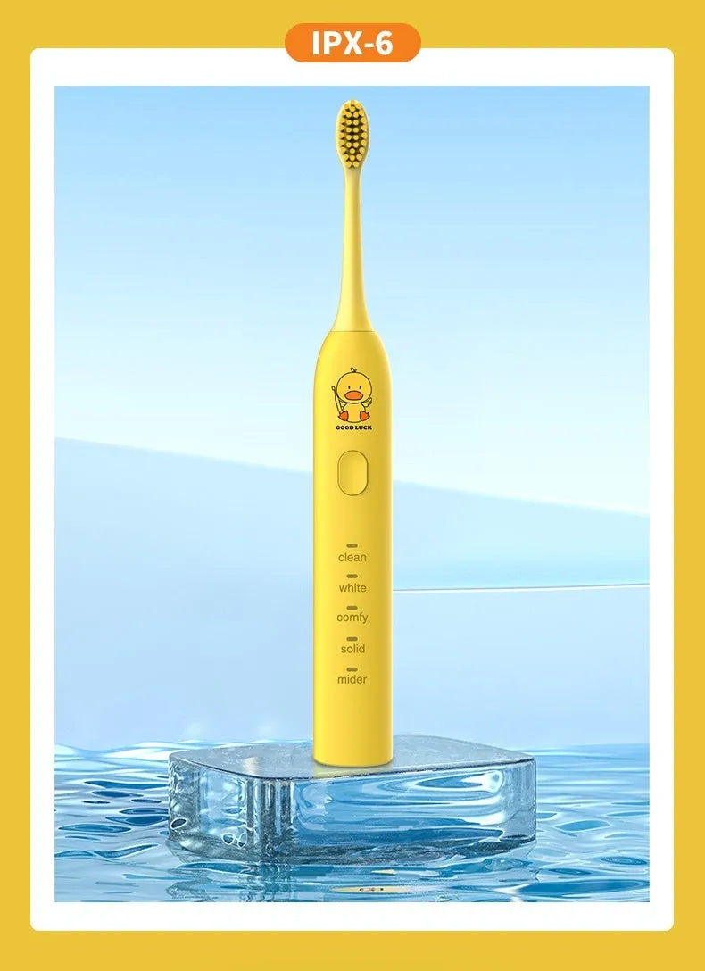 Small yellow duck design rechargeable electric toothbrush with soft bristles.