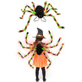 Orange Halloween spider backpack with glowing LED lights on a model, showing plush fabric.