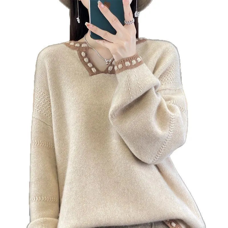 Women's camel V-neck long sleeve viscose sweater laid flat.