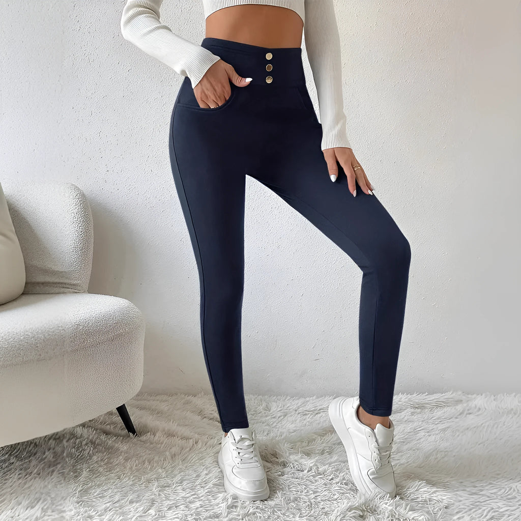 Navy blue high-waist straight leg women's trousers on a hanger.