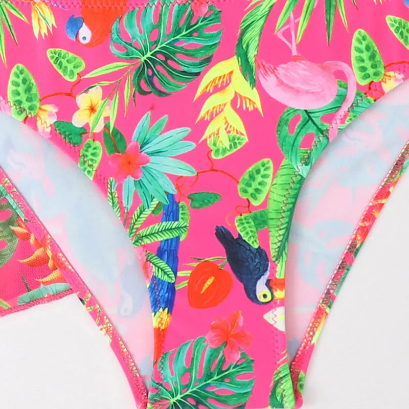 Girls floral print bikini swimsuit on hanger, showing two-piece design and overlay detail.