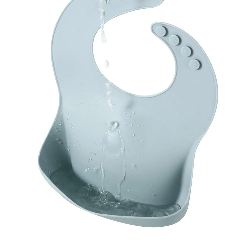 Soft silicone baby bib with deep spill pocket in classic colour, adjustable neck strap, waterproof feeding essential