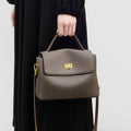 High-grade genuine leather women's postman handbag in grey viney with lock closure and sandwich pocket