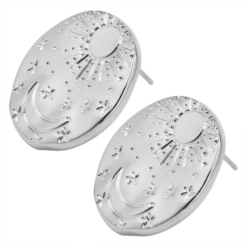 A pair of geometric shell design stud earrings in 304 stainless steel with a gold electroplated finish.