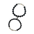 Black obsidian Buddha bead couple bracelets showing 8mm and 10mm sizes on a background.