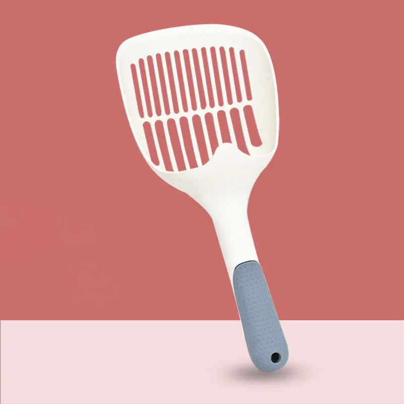 Large white plastic cat litter shovel with angled handle on a grey background.