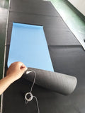 Blue yoga mat with plant patterns, showing grounding wire and non-slip texture.