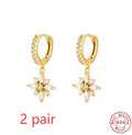 Sterling silver snowflake pendant earrings with diamond accents in geometric design