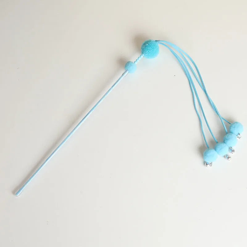 Flexible cat wand toy with colourful tassel attachment for interactive indoor play sessions