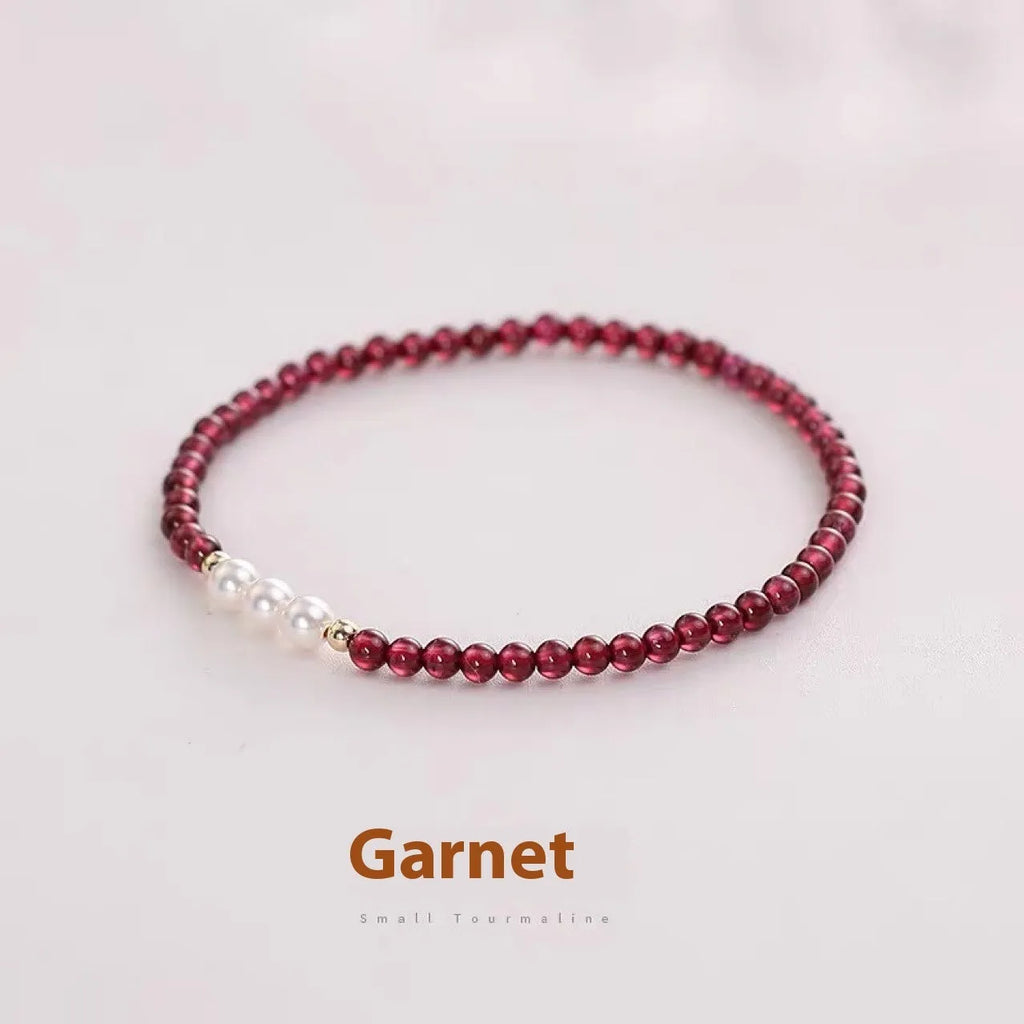Women's crystal bracelet with Chinese garnet beads and artificial pearls on wrist