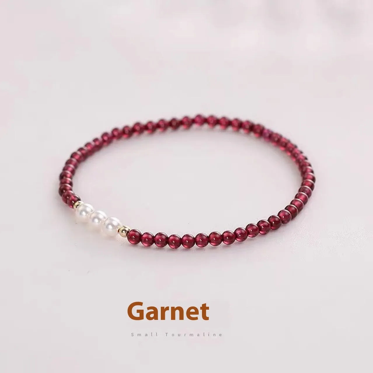 Women's crystal bracelet with Chinese garnet beads and artificial pearls on wrist