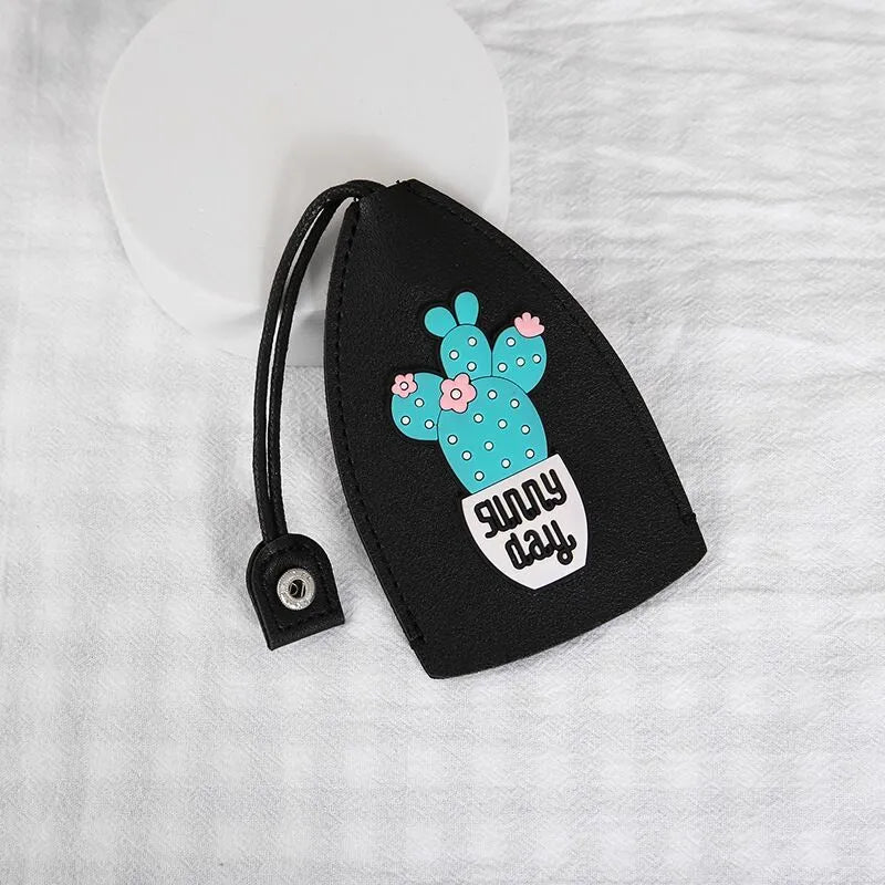Cartoon pull-out key case in PU leather measuring 14 x 7.5 cm with colourful designs