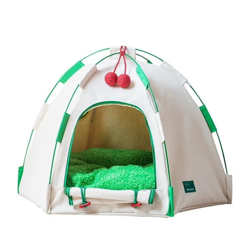 Beige dome-shaped cloth cat tent with a thick padded mat inside, shown on a wooden floor.