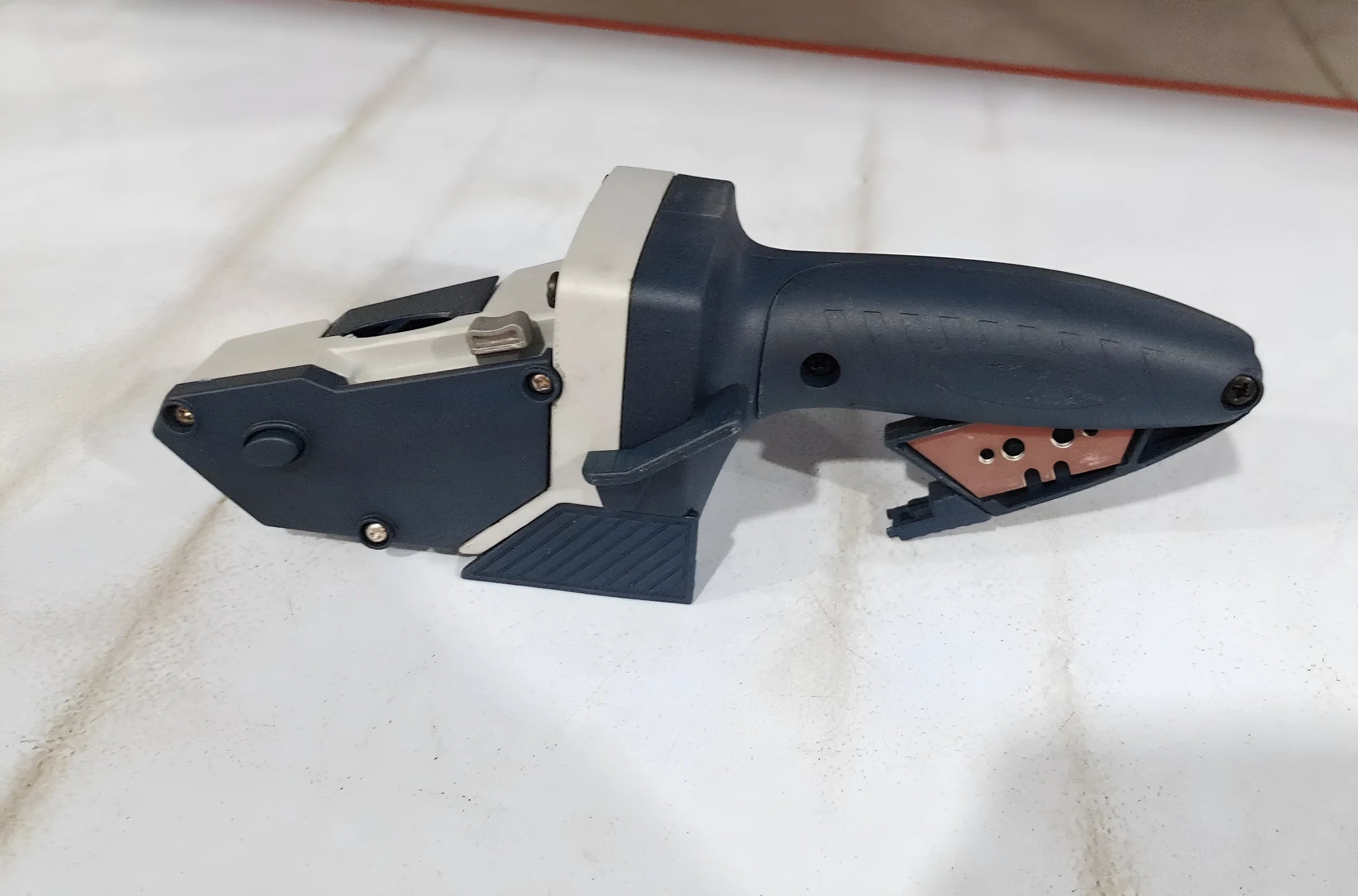 Blue multifunctional woodworking cutter tool with measuring scale for cutting board and foam