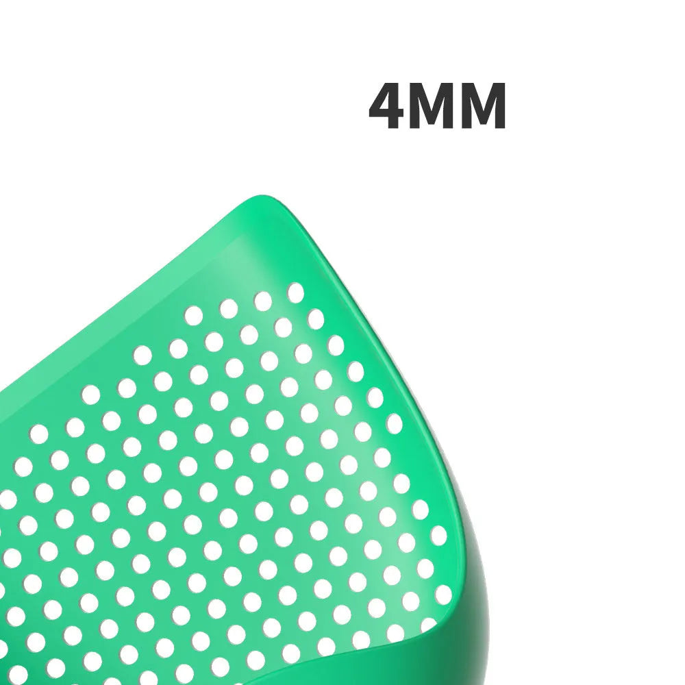 Green plastic cat litter scoop with hollow head and handle on white background