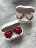 Heart-shaped wireless Bluetooth headphones in red and pink colour options