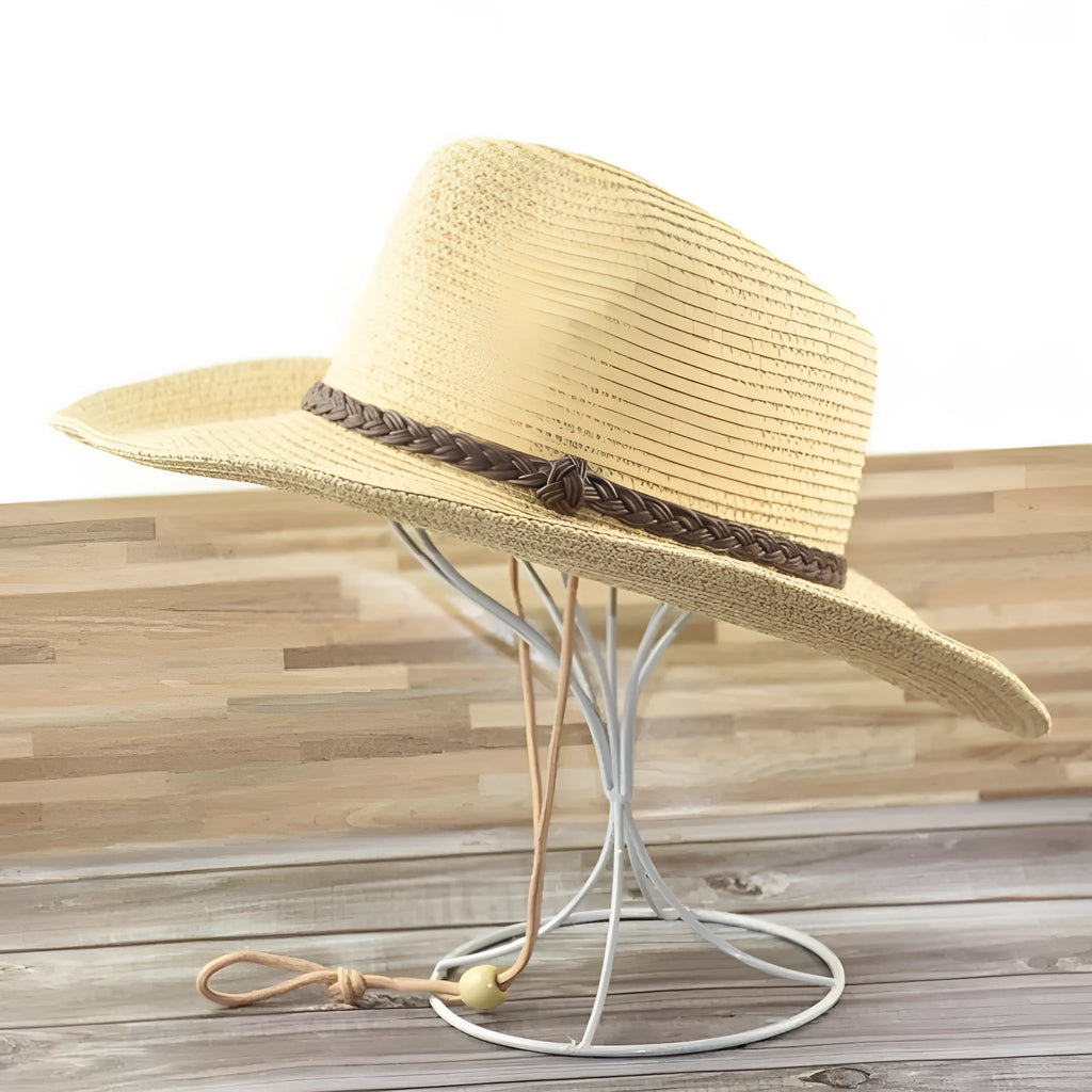Men's foldable wide-brim straw sun hat in beige, shown on a neutral background.