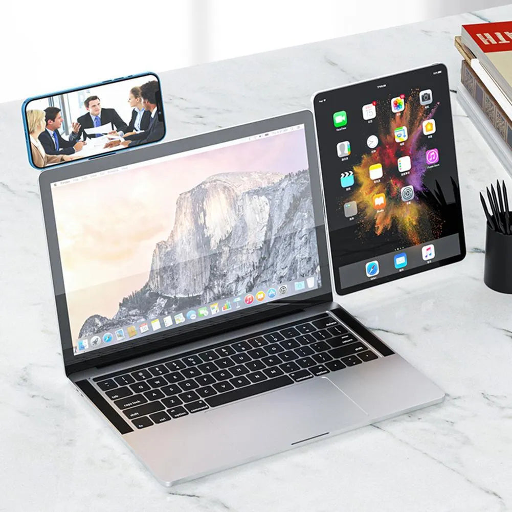 Black magnetic laptop phone holder attached to computer monitor with smartphone mounted